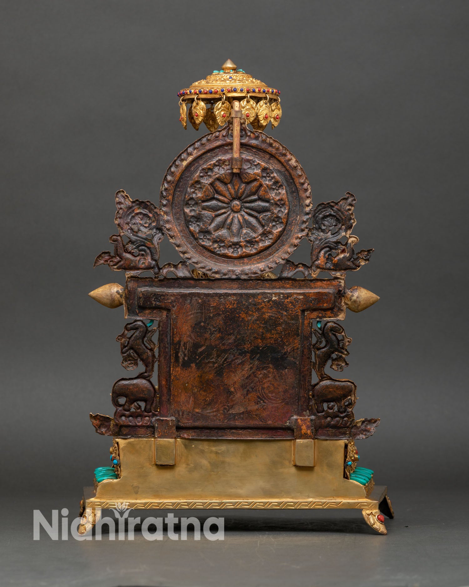 Back view Shakyamuni Buddha statue ornate throne craftsmanship intricate scrollwork halo design copper Himalayan art sculpture for altar