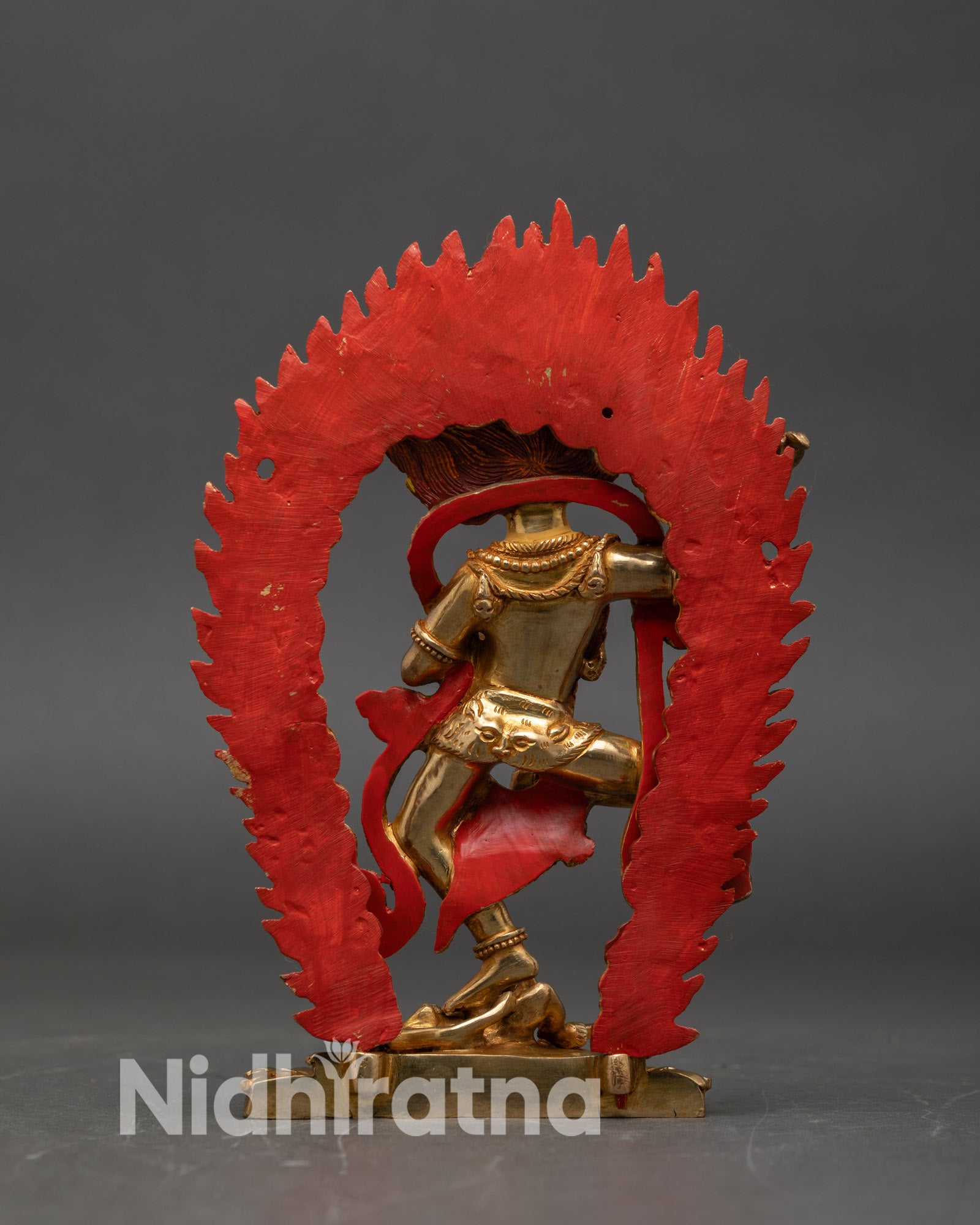 Back view Simha Mukha sculpture lotus seat subdued human figure flaming halo Nepalese art