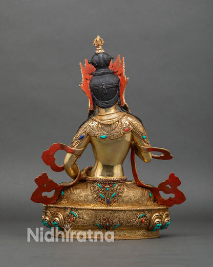 Back view of Vajrasattva statue showing detailed robes and lotus throne