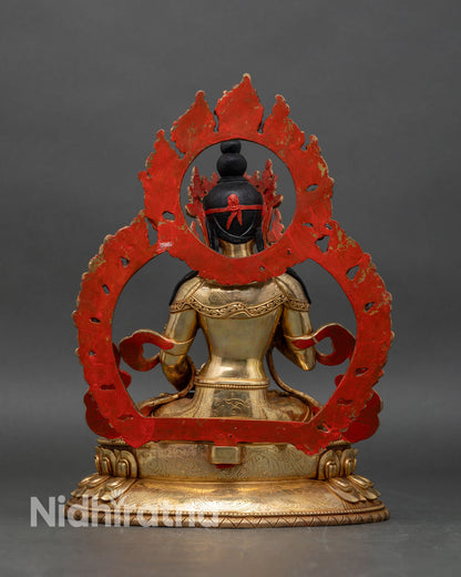 Back view of Vajrasattva statue, ornate lotus seat and radiant flaming aureole