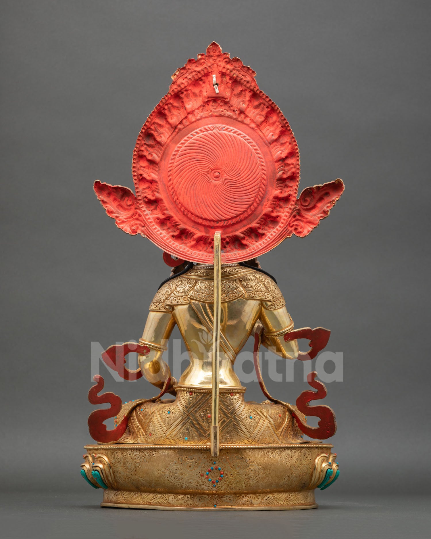 Back view of Vajrasattva statue traditional Newari lost wax copper sculpture with ornate robes gold finish and sacred altar art design