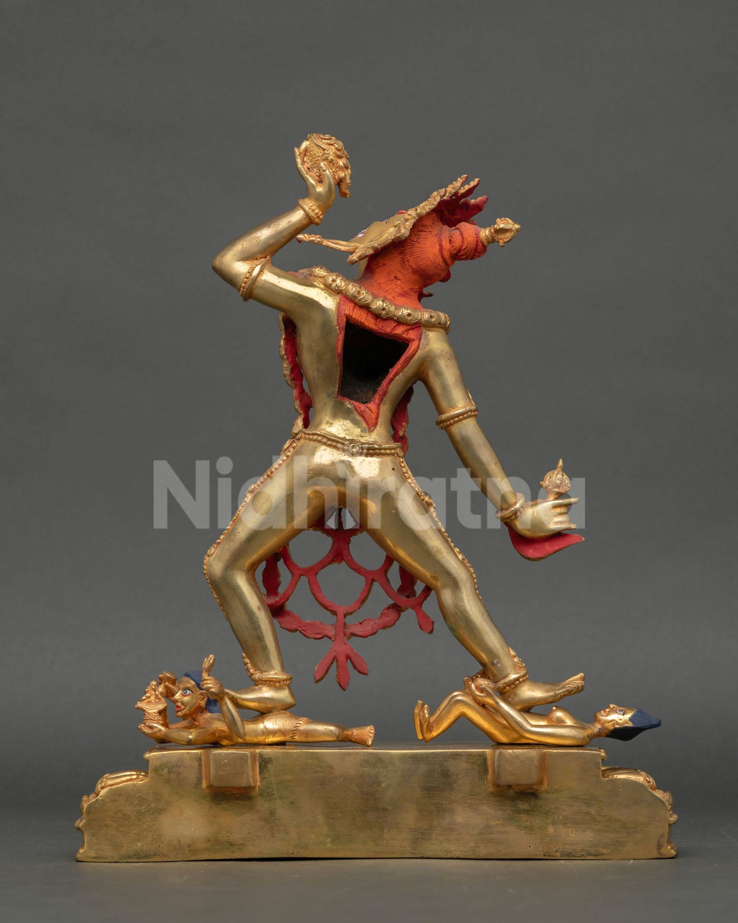 Back view of Vajrayogini Buddhist statue with ornate copper detailing flaming halo design and lost wax Himalayan metal artistry