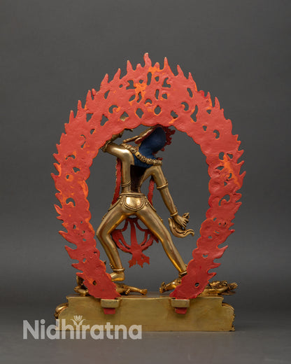 Back view Vajrayogini statue handcrafted Nepal copper sculpture lotus base two subdued figures sacred Tibetan Buddhist deity art.