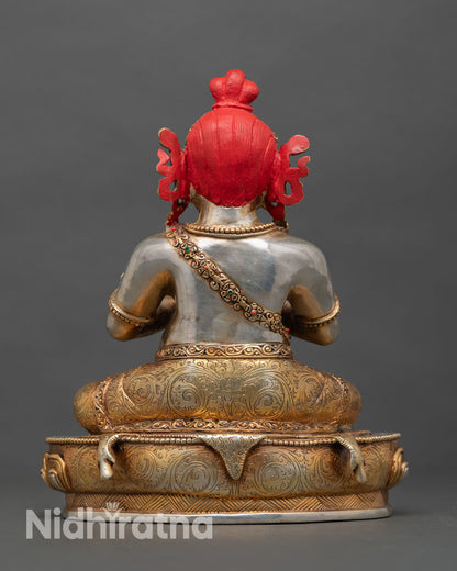 Back view of Virupa statue showing ornate carving silver plating and traditional Nepalese lost wax work