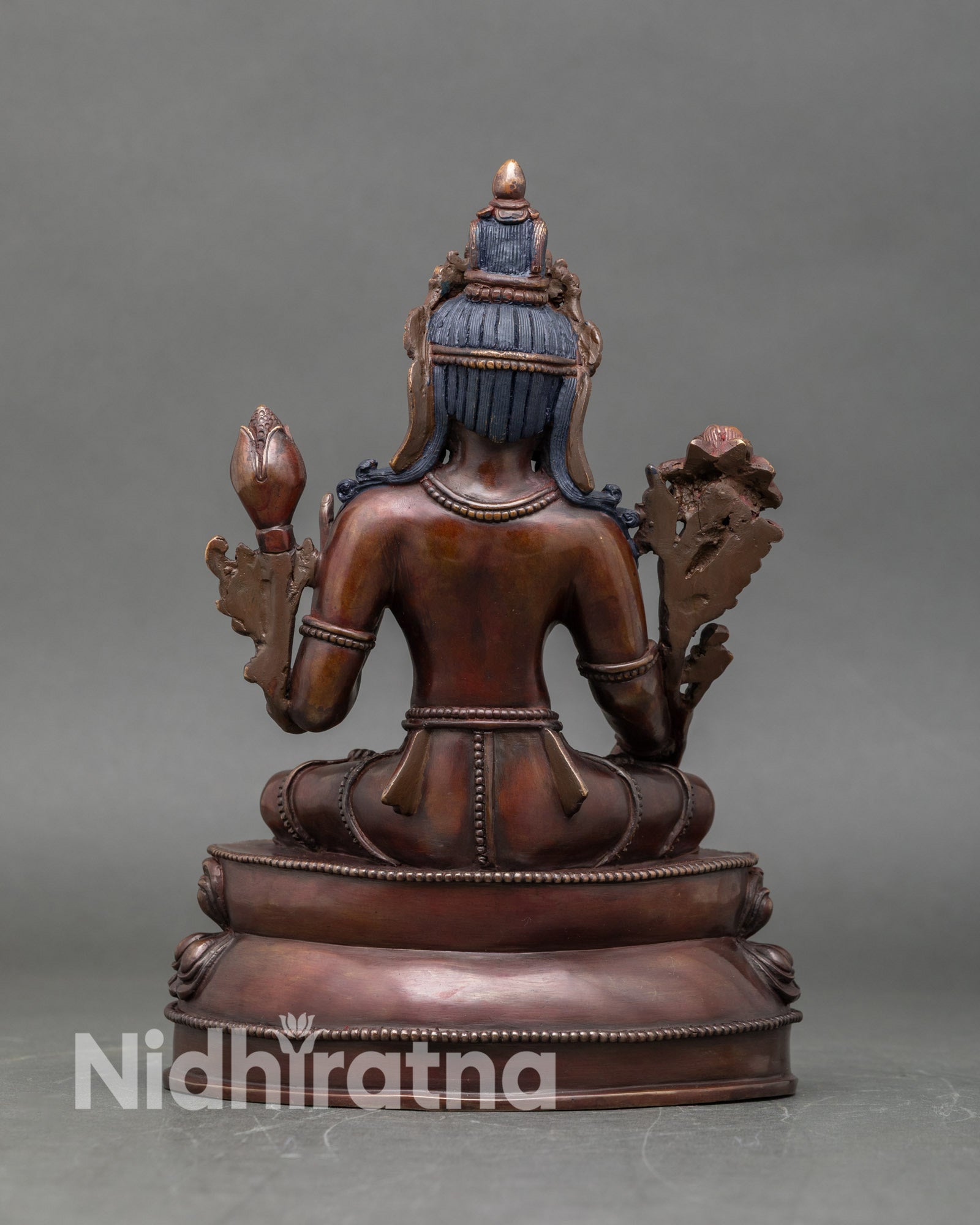 Back view of White Tara sculpture Himalayan Buddhist deity intricate robes protective energy