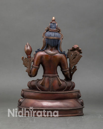 Back view of White Tara sculpture Himalayan Buddhist deity intricate robes protective energy