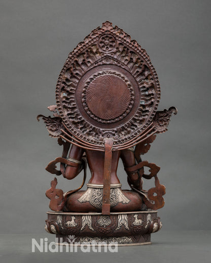 Back view White Tara statue handcrafted in copper with oxidized silver plated finish, radiant halo and intricate Himalayan artistic detailing