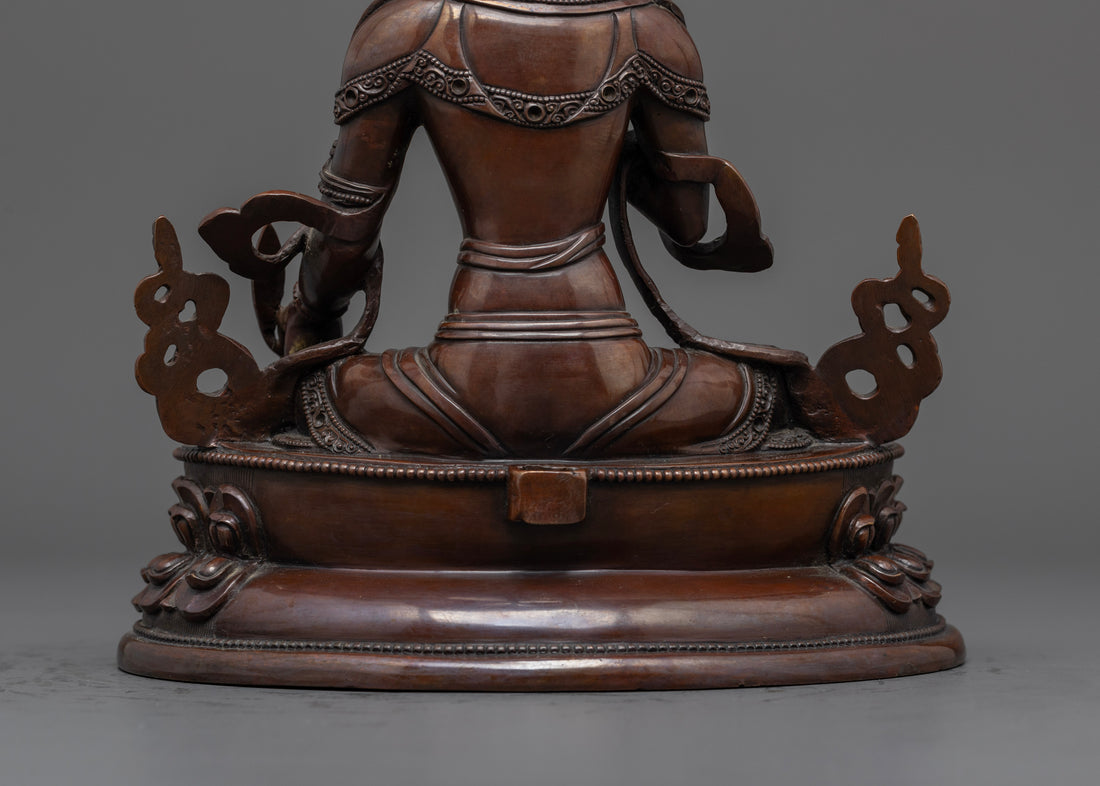 back view of Kshitigarbha statue made from oxidized copper