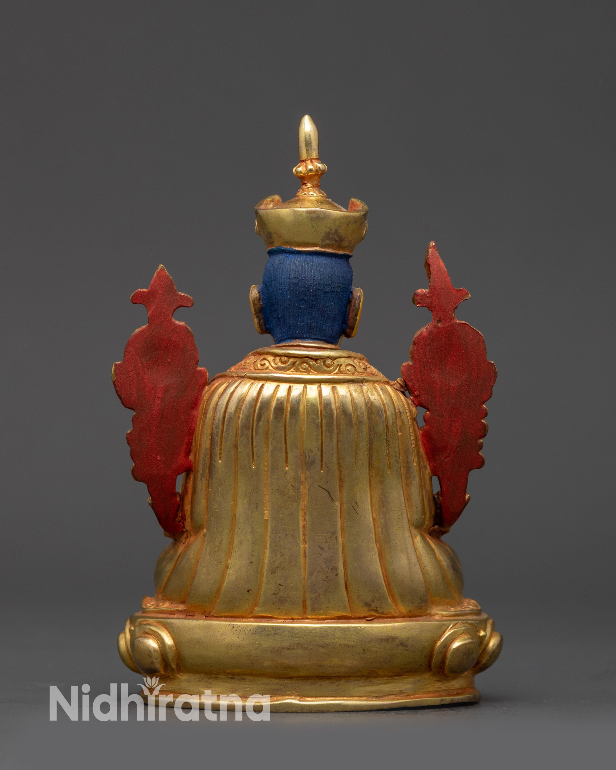 back view Gyalwang Karmapa Buddhist statue showing detailed robe folds and lotus base