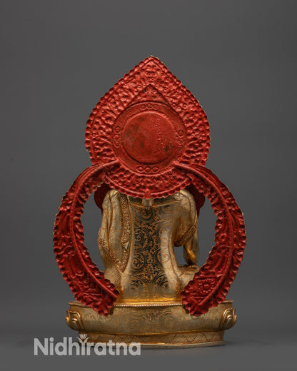 back view Jowo Shakyamuni Buddha statue showing engraved halo and finely detailed robe carvings
