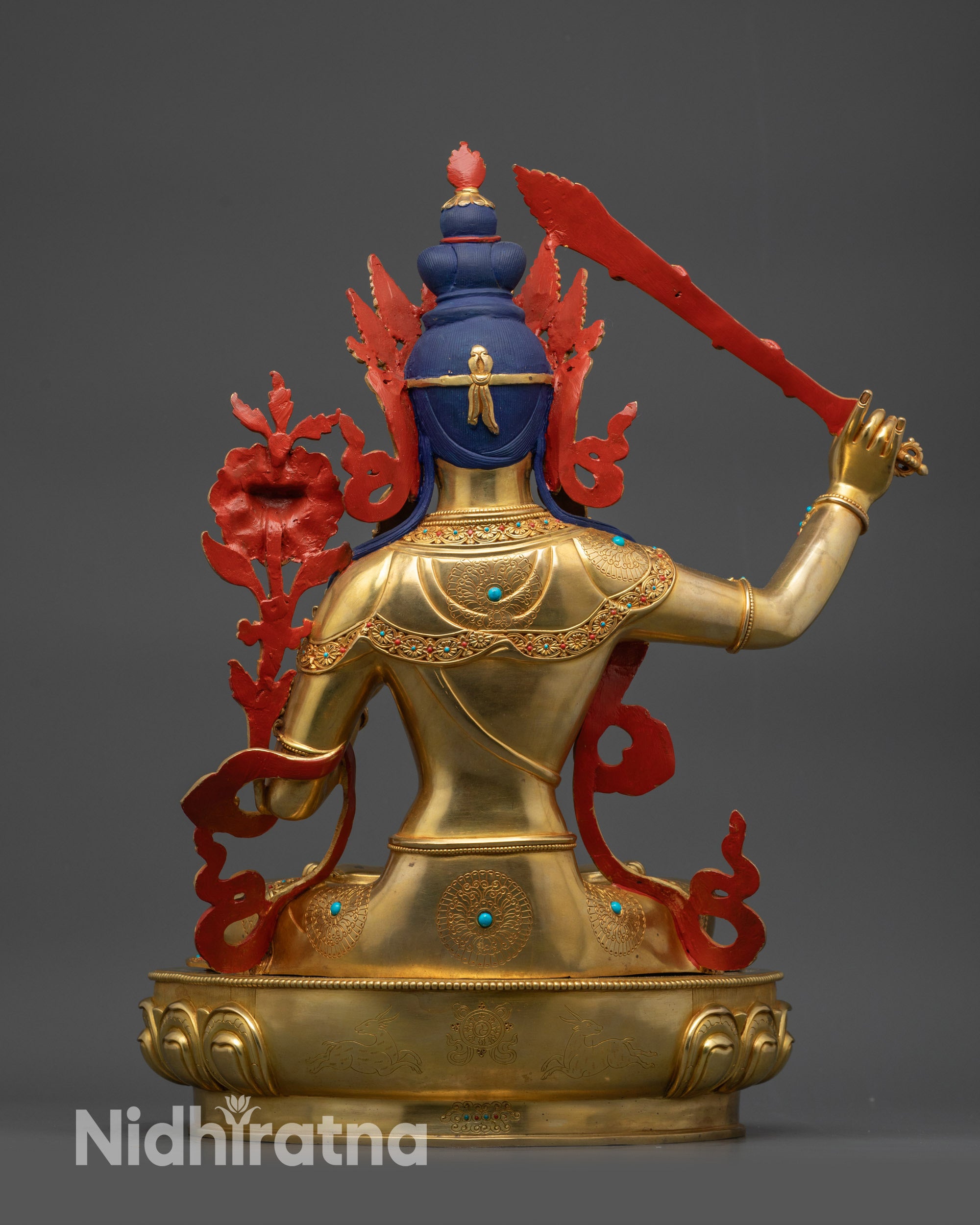 back view Manjushri statue with detailed robe patterns and copper craftsmanship