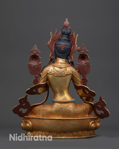 back view green tara buddhist statue displaying lotus base and tibetan carvings