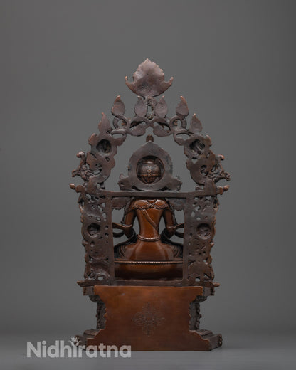 back view of Amitayus statue showing Vishva Vajra symbol and detailed oxidized finish