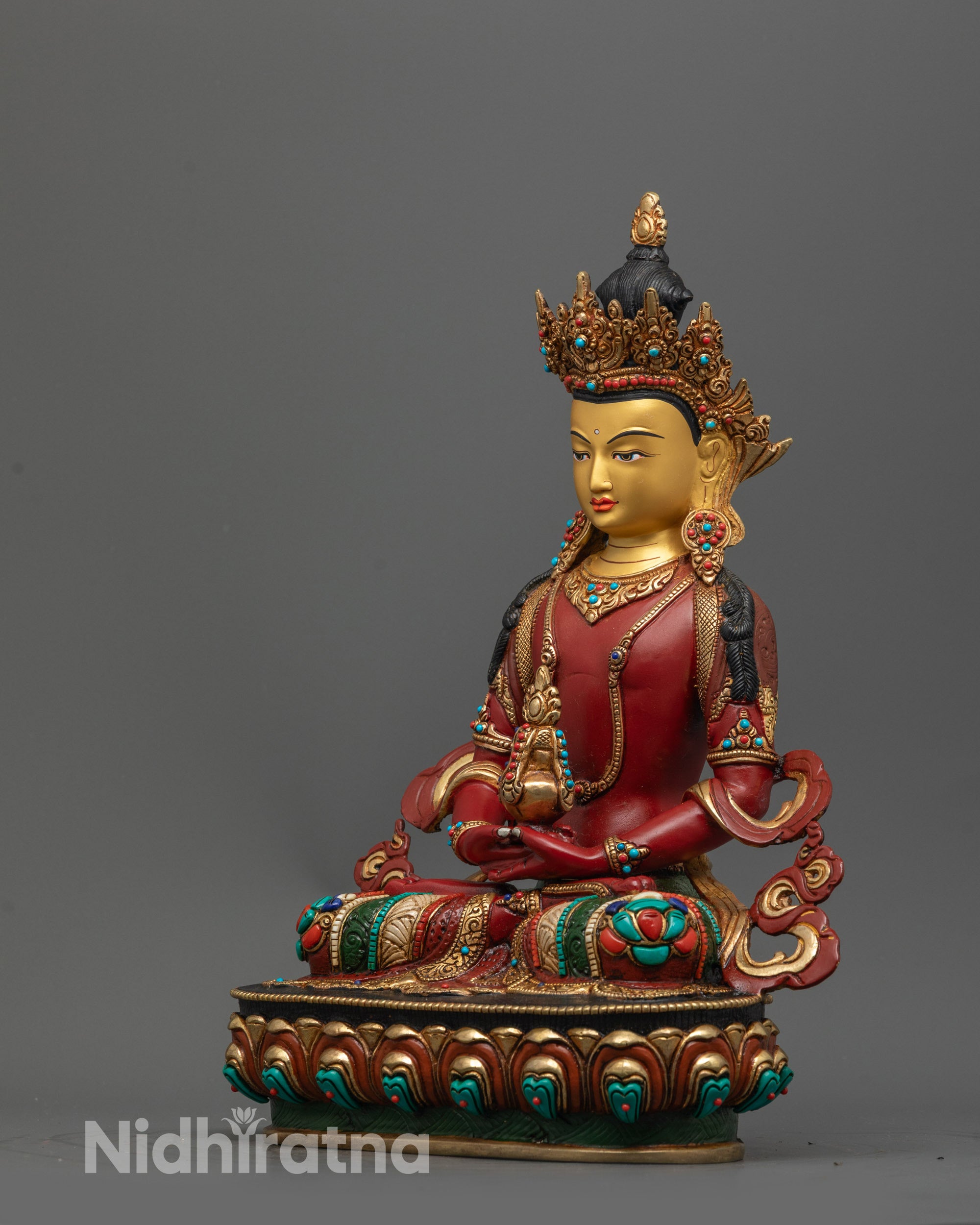 back view of Amitayus statue with detailed robe and semi-precious stone inlays