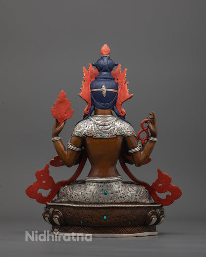 back view of Chenrezig Statue highlighting oxidized finish and silver-plated carvings