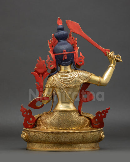 back view of Manjushri statue featuring lotus seat floral carvings and robe details