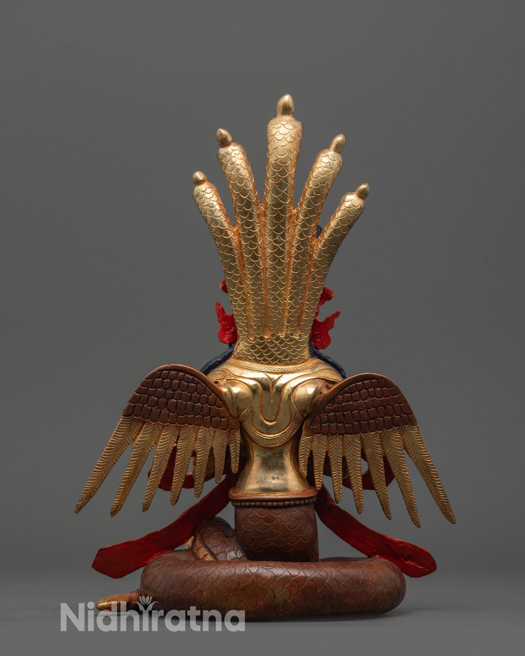back view of Naga Kanya statue featuring delicately carved wings and intricate serpent details
