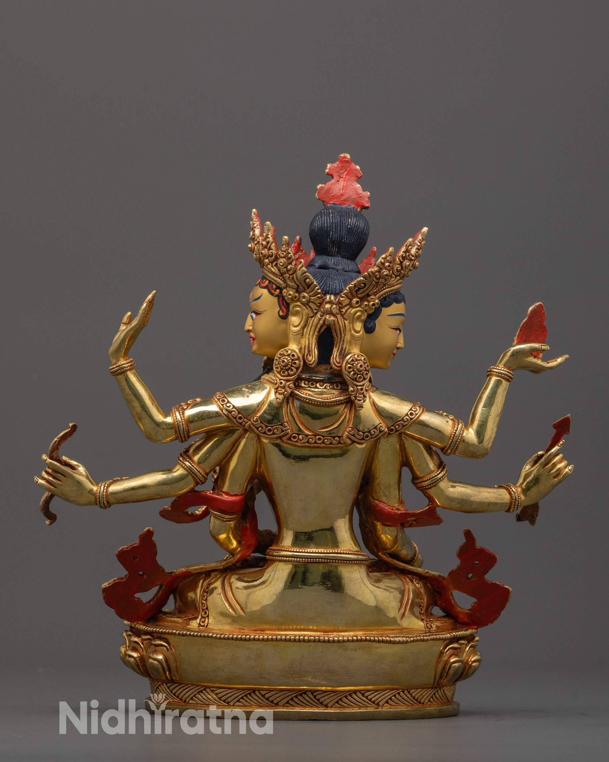 back view of Namgyalma statue displaying robe patterns and lotus base carving
