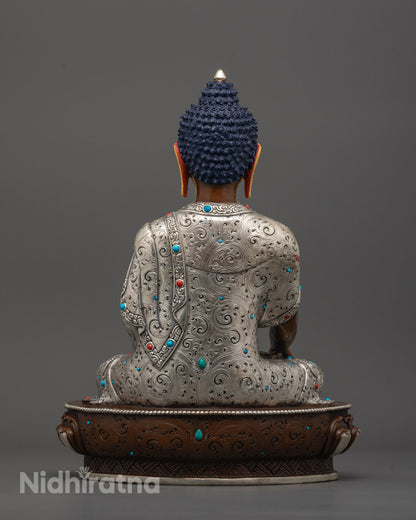 back view of Shakyamuni Buddha Statue highlighting oxidized copper body and ornate robe carving