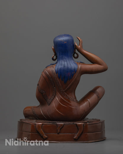 back view of Tibetan Milarepa statue highlighting throne base and oxidized copper texture