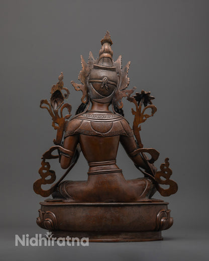 back view of artisan-made green tara statue with oxidized copper and fine craftsmanship