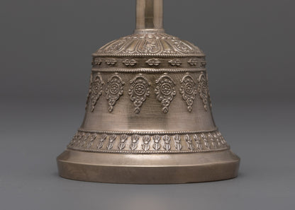 back view of bell highlighting bronze bell body and ornate carved details