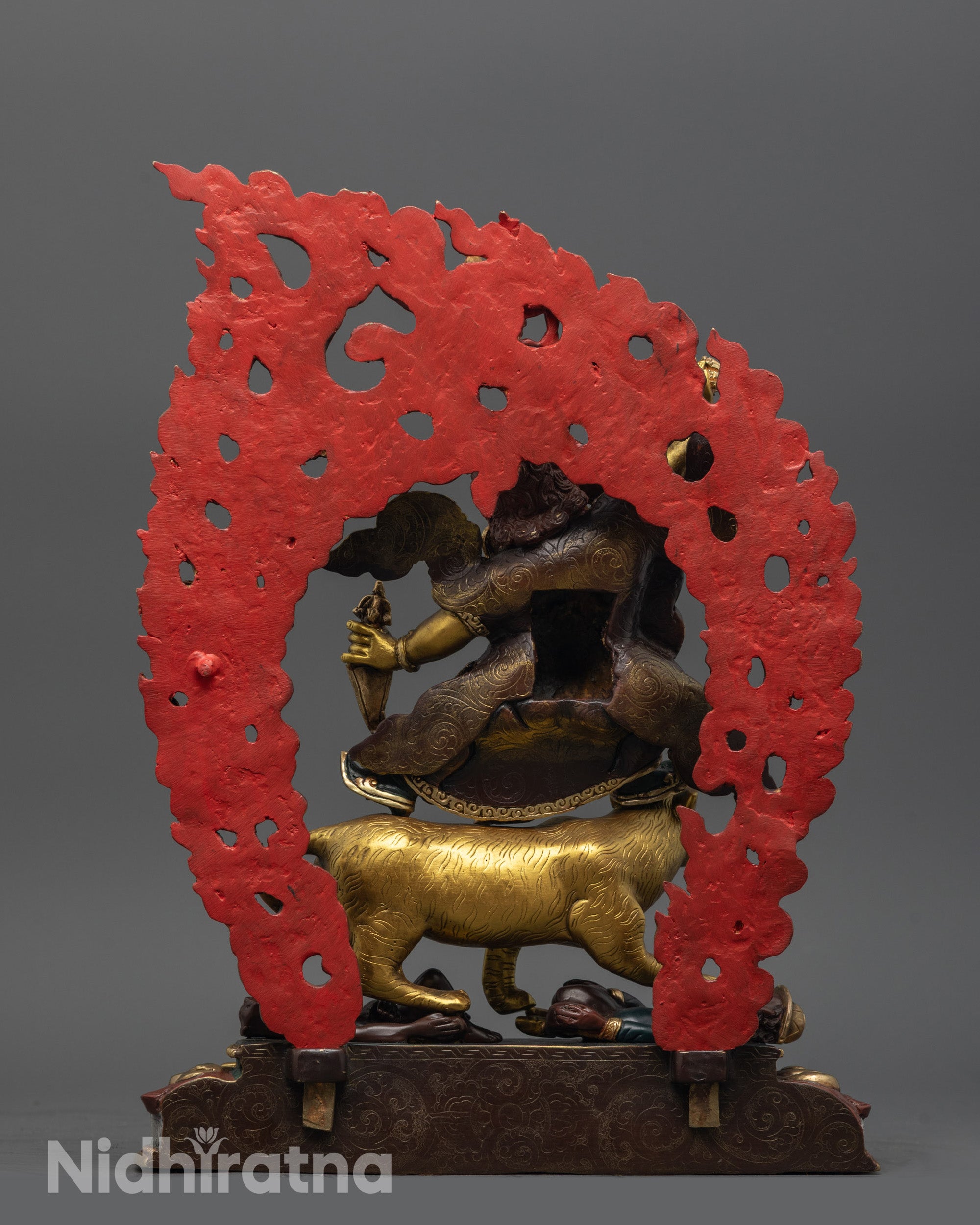 back view of dorje drolo statue with oxidized halo and miniature garuda figurine