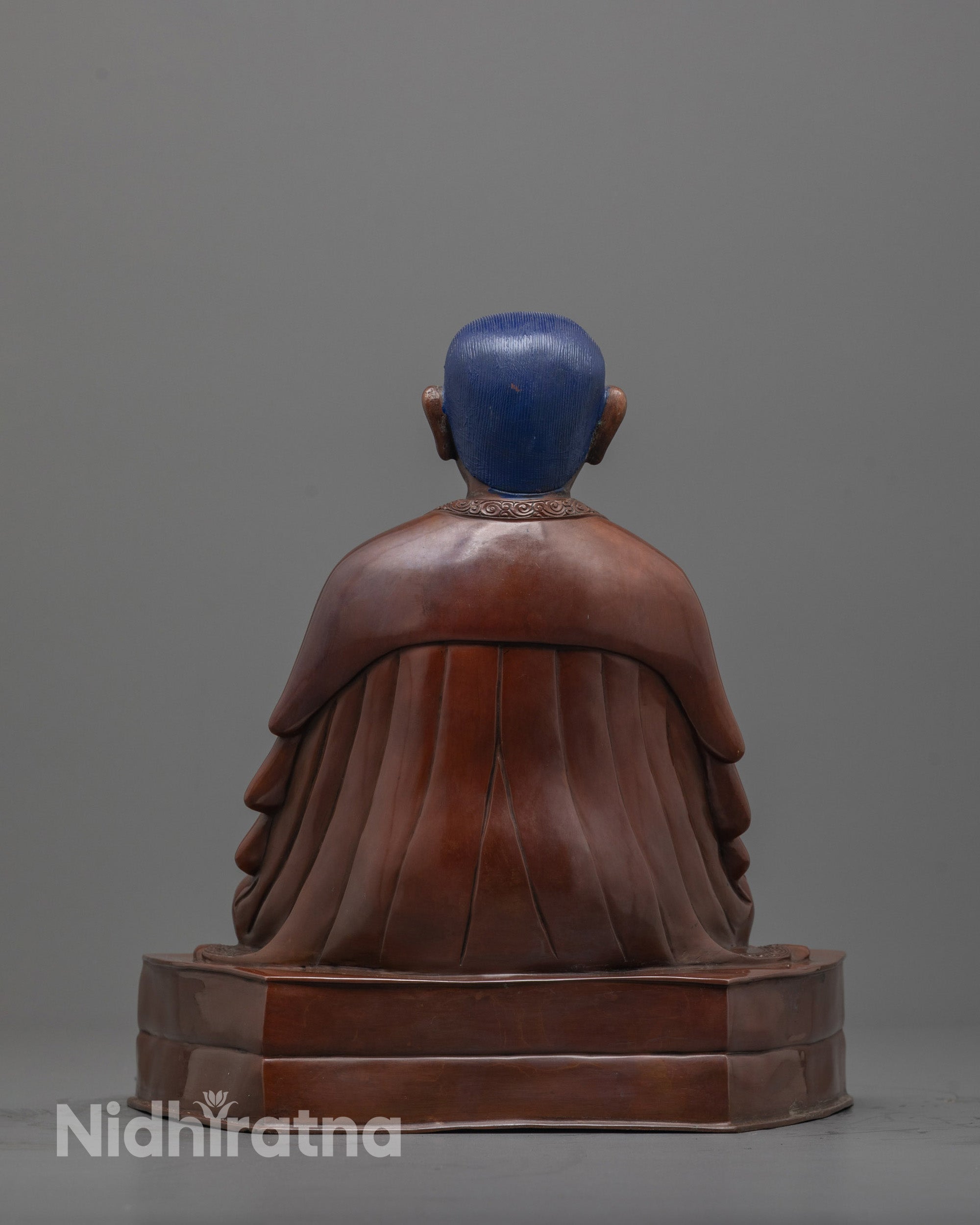 back view of handcrafted Marpha Statue showing oxidized finish and robe detailing