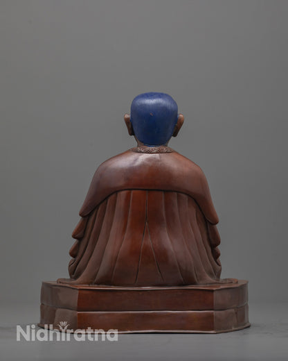 back view of handcrafted Marpha Statue showing oxidized finish and robe detailing