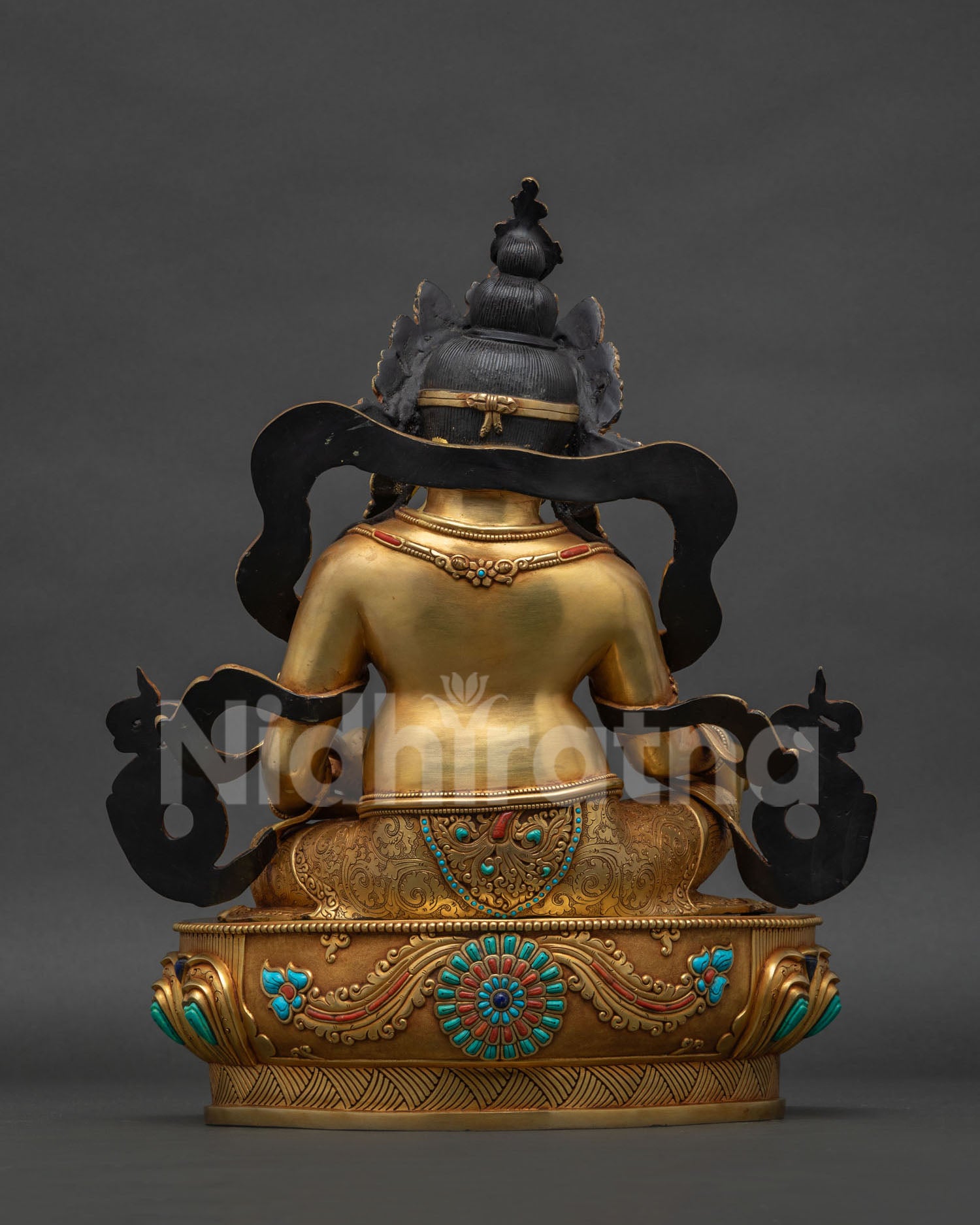 back view of handcrafted dzambhala statue showing intricate copper sculpture details