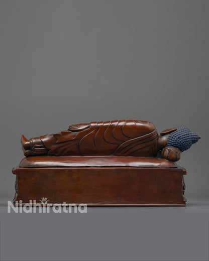 back view of handcrafted nirvana buddha statue made using lost wax technique in oxidized copper
