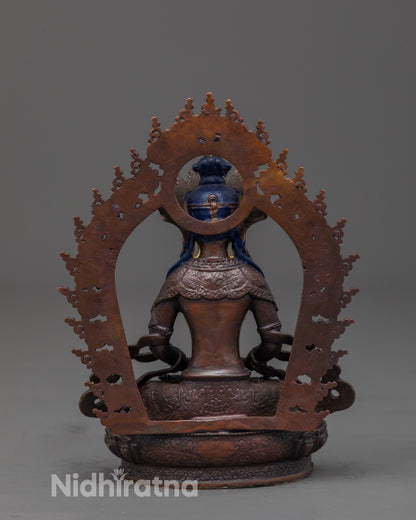 back view of machine-made amitayus statue showing halo and robe craftsmanship