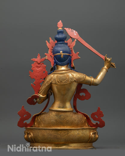 back view of manjushri statue showing detailed robe jewelry and lotus seat patterns in copper finish