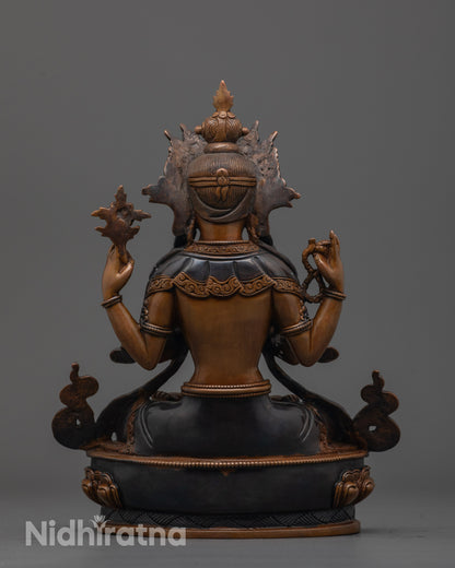back view of oxidized Avalokiteshvara statue showing robe details and lotus throne design