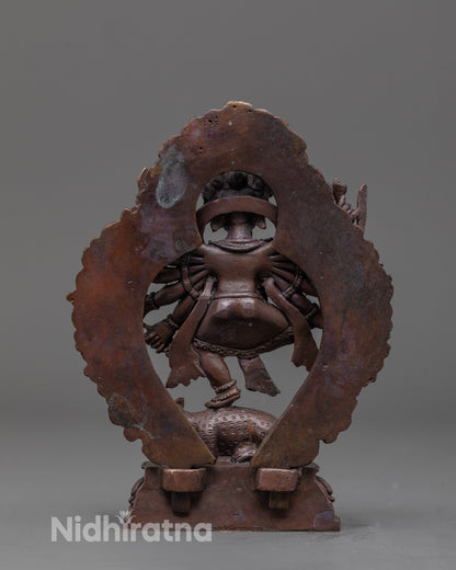 back view of oxidized Ganesha statue with halo and fine traditional carvings on robe