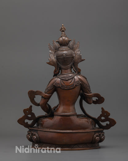 back view of oxidized dorje sempa statue showing detailed robe and copper finish