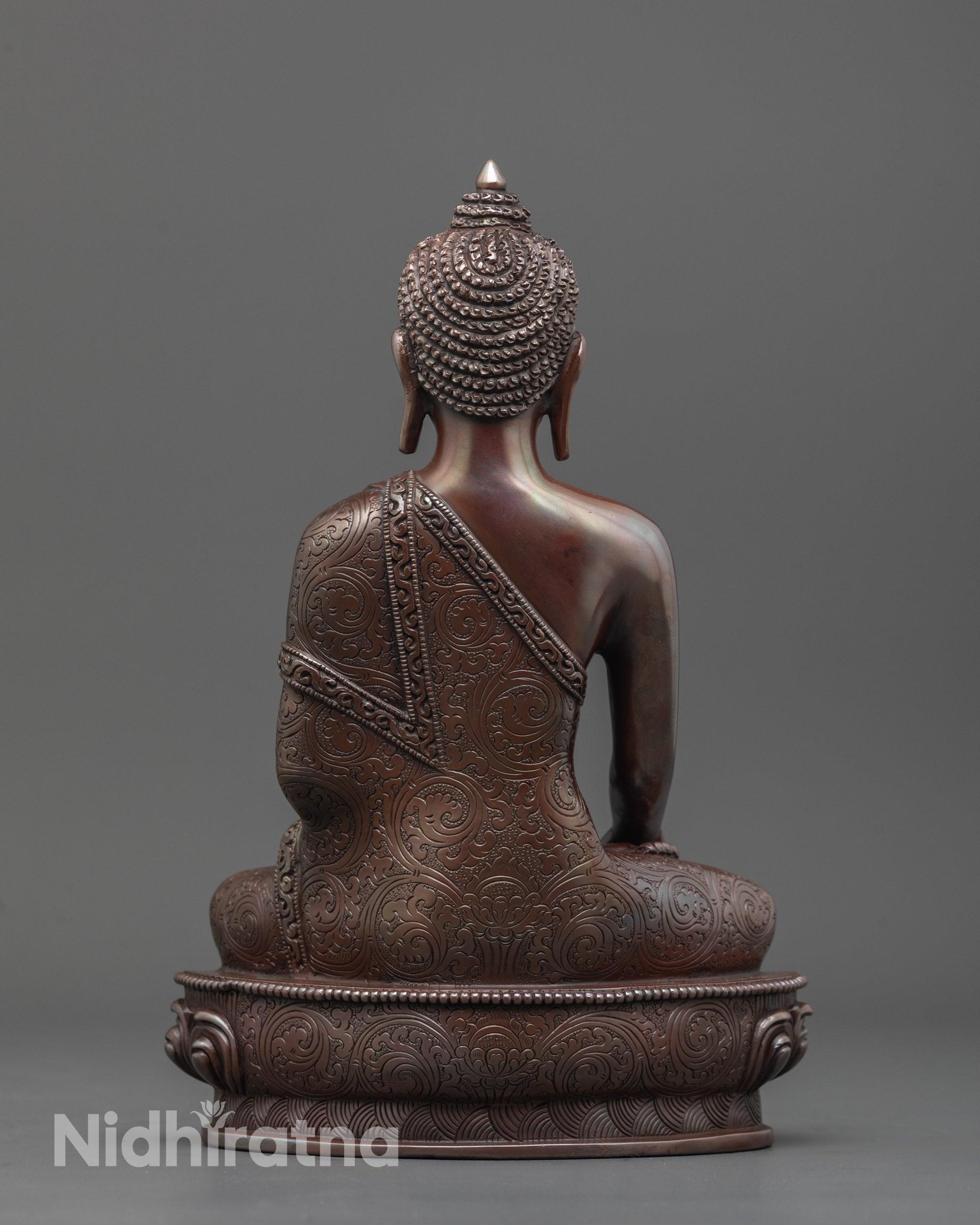 back view of oxidized shakyamuni buddha statue highlighting dark finish and fine craftsmanship