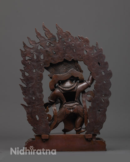 back view of oxidized vajrapani statue highlighting oxidized copper texture and halo detailing