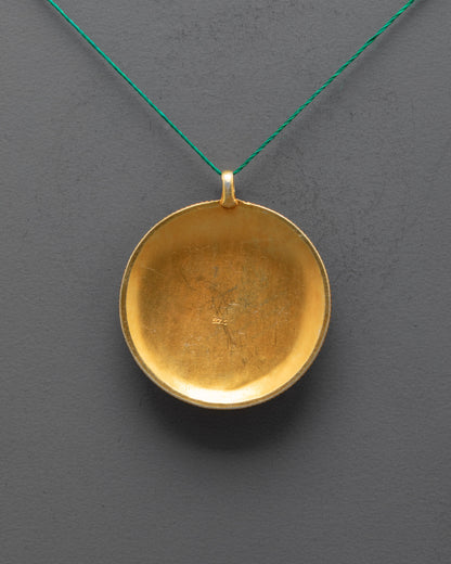 back view of sacred mandala locket highlighting detailed filigree and gold-plated body