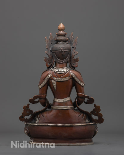 back view of silver-plated long life deity statue with detailed robe and oxidized copper finish