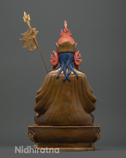 back view of tsokye dorje statue on partially gold gilded lotus seat with fine details