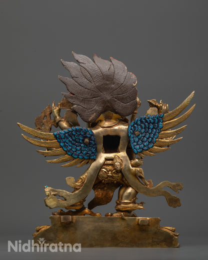 back view of vajrakilaya statue displaying wings, skull garland, and detailed garments