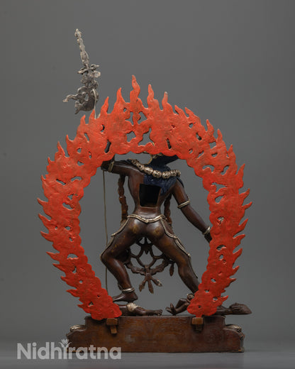 back view of vajrayogini statue with intricate flaming halo and silver-plated finish