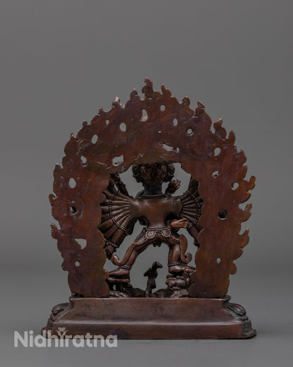 back view of yamantaka statue highlighting radiant halo and intricate copper carvings
