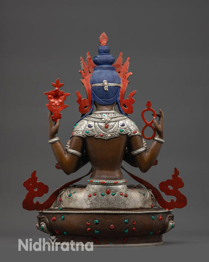 back view oxidized Chenrezig statue showing robe, lower garments, and semi-precious stone details