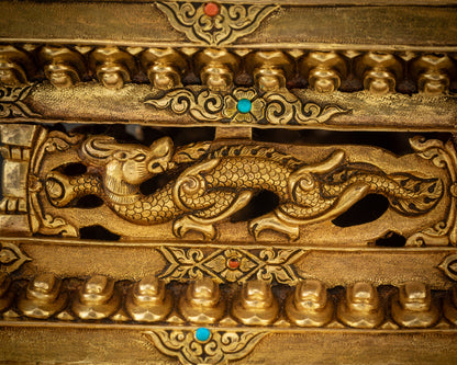 base detail Chenrezig Avalokiteshvara statue dragon carving with 24K gold accents Nepal

