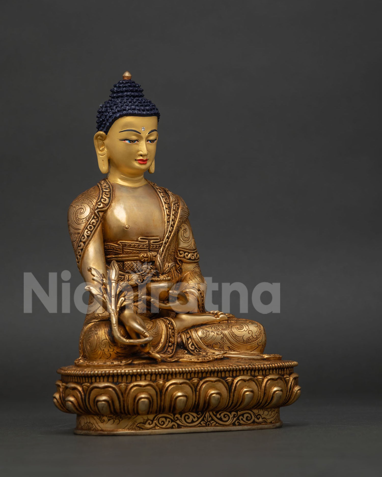 Bhaisajyaguru Buddha statue from Nepal with hand chiseled floral motifs and healing vessel.