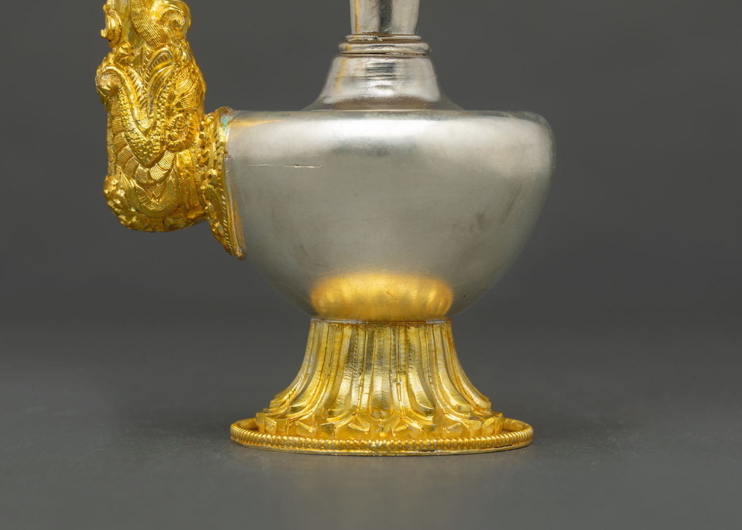 Bhumba vase ornate lid sacred mantra engraving floral motifs gold plated detailing Himalayan Buddhist ritual craftsmanship