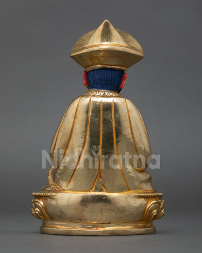 Bhutanese Buddhist leader statue highlighting flowing robes lotus seat and Himalayan artisan metalwork