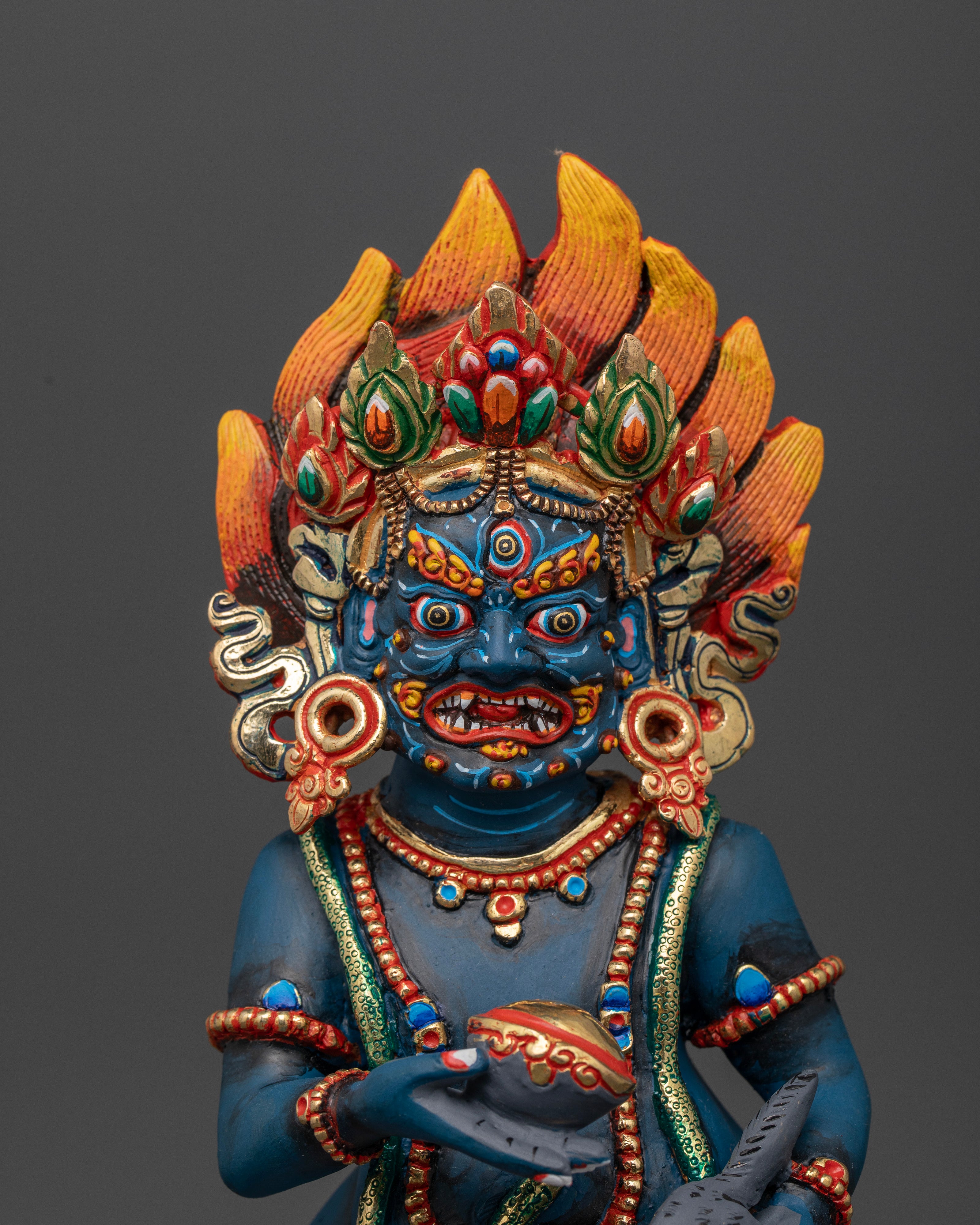 Black Dzambhala holding skull cup treasure spitting mongoose.